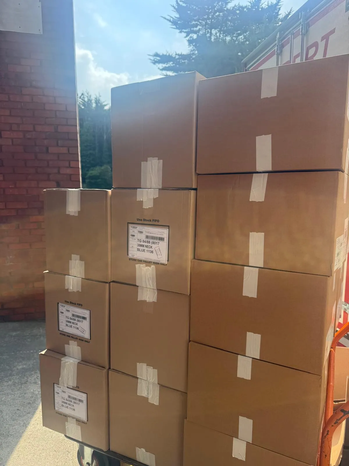 Boxes stacked for a flat move with shared stairs