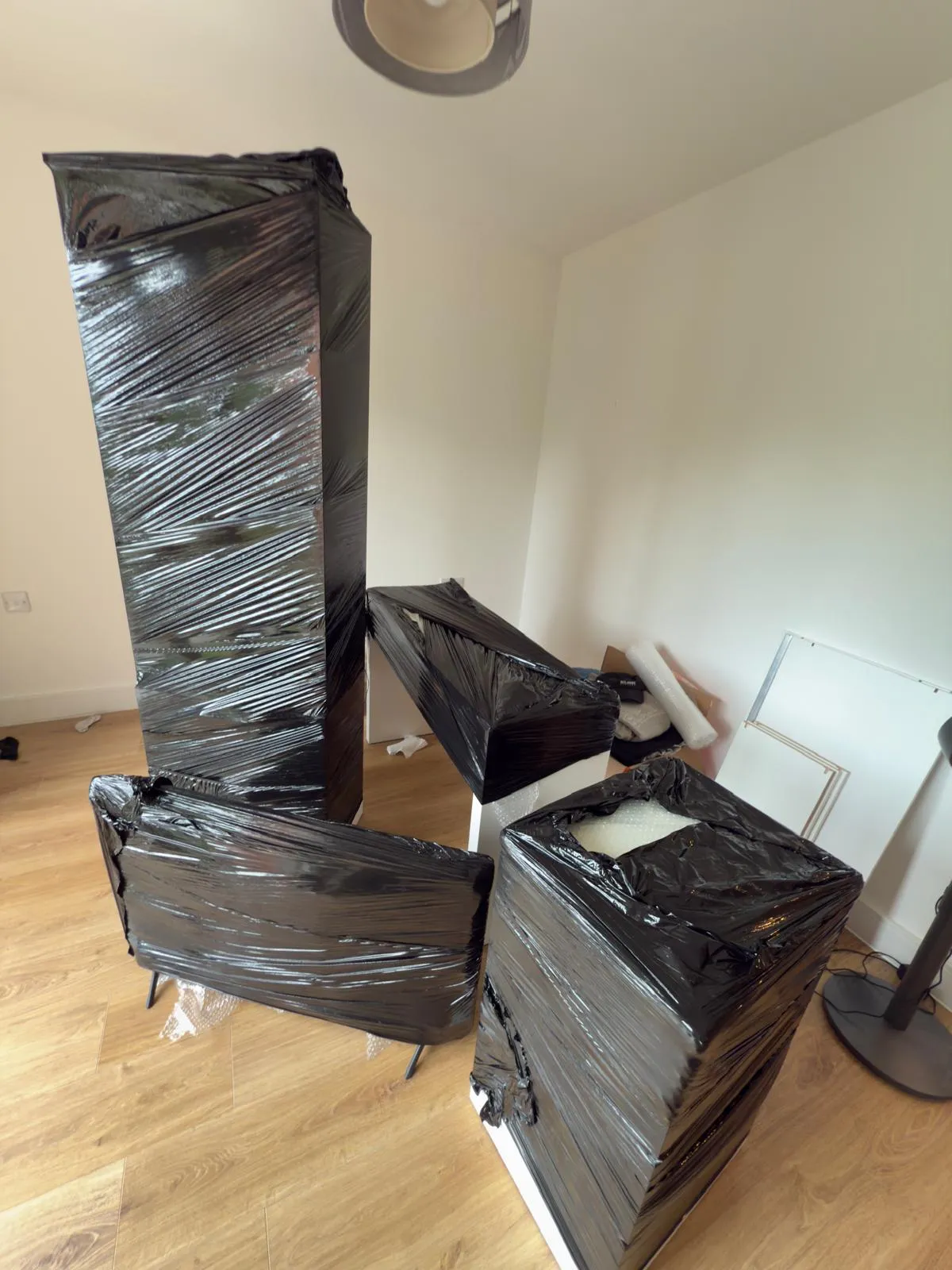 An upright piano protected before a move